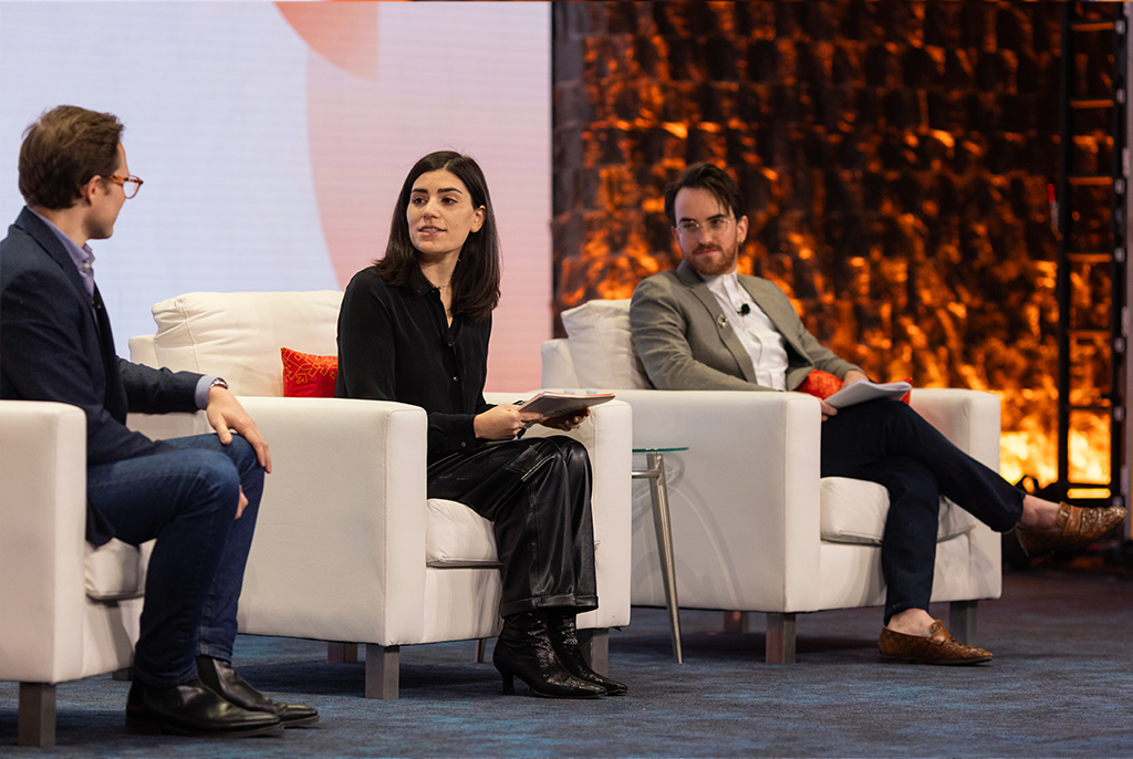Jill Noeh, Hunter Thomas, and Max Glickman sitting together talking while on stage